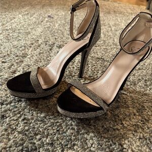 Women’s size 8 silver and black heels